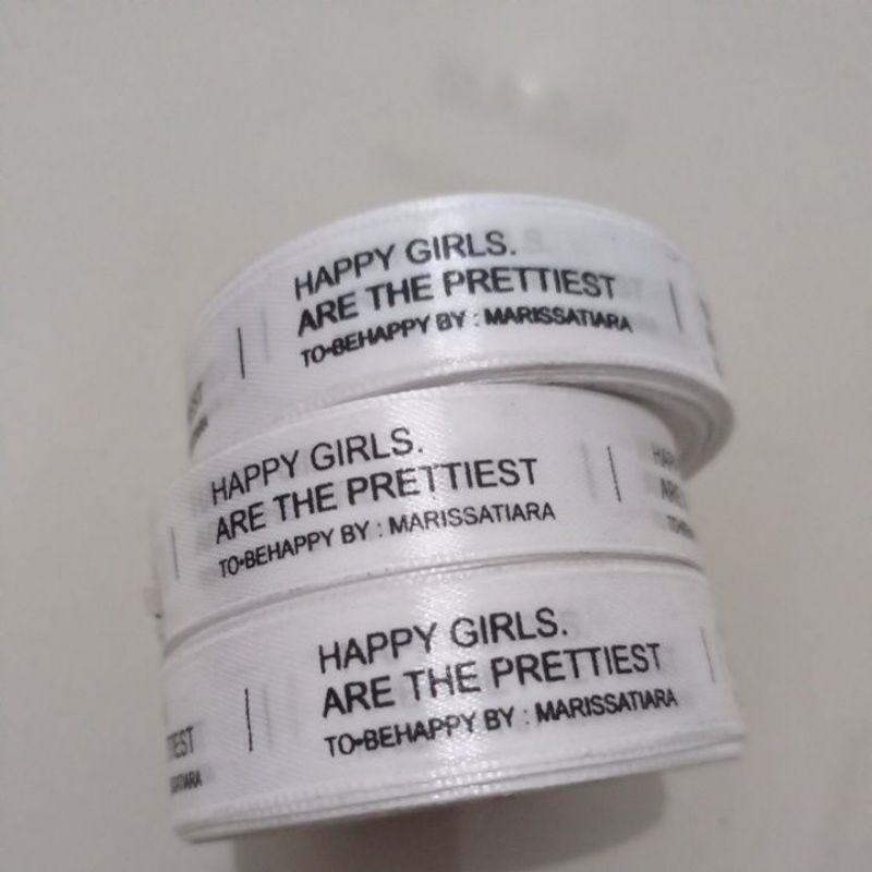 

Label baju satin 180 meter roll panjang