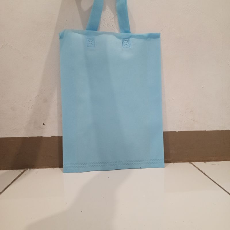 

tas spunbond 30×40 lipat samping 65gsm isi 12pcs