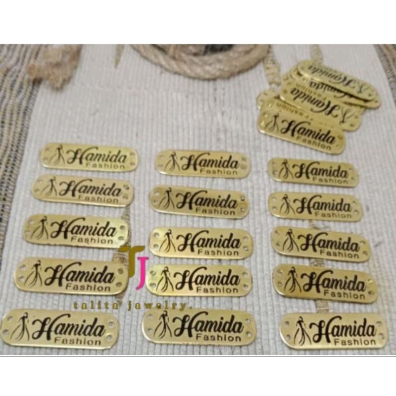 

LABEL PLAT LOGO HIJAB & NAMA BAHAN STAINLESS STELL/KUNINGAN, BISA CUTOM SESUAI SELERA