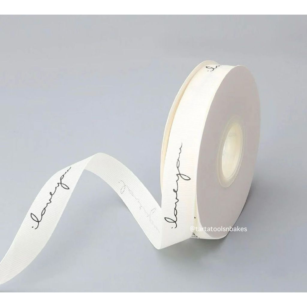

Pita Polyster Putih Motif Tulisan l Lebar 2,5cm l (per 1 meter)
