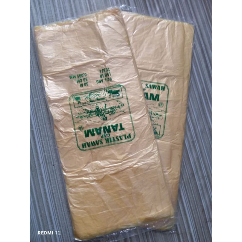 plastik meteran / plastik balon warna kuning cap tanam