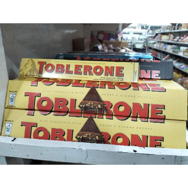 

Toblerone Chocolate With Honey & Almond Nougat Impor Switzerland