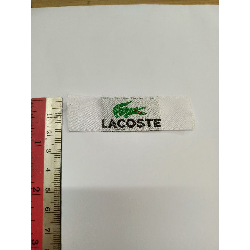 

Lacoste Saten Label 1 x CO Kirim 600 pcs