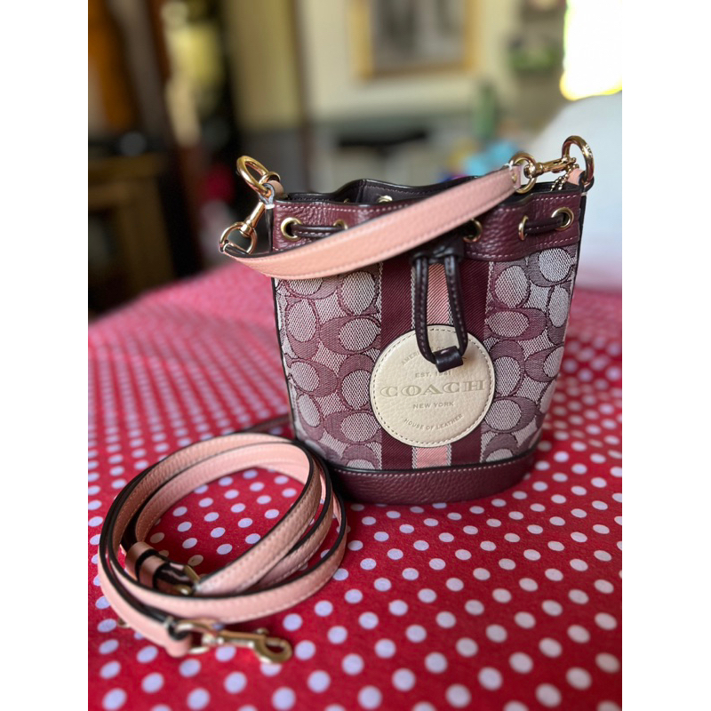 preloved tas ORI coach dempsey mini drawstring wine