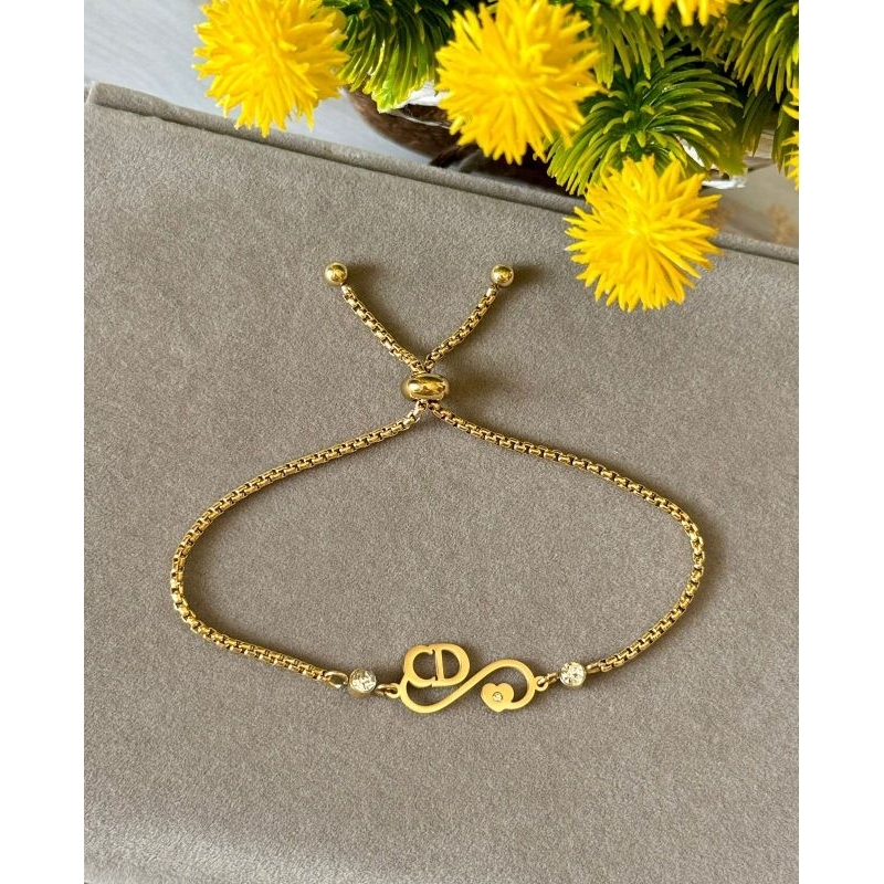 Gelang serut titanium CD gold