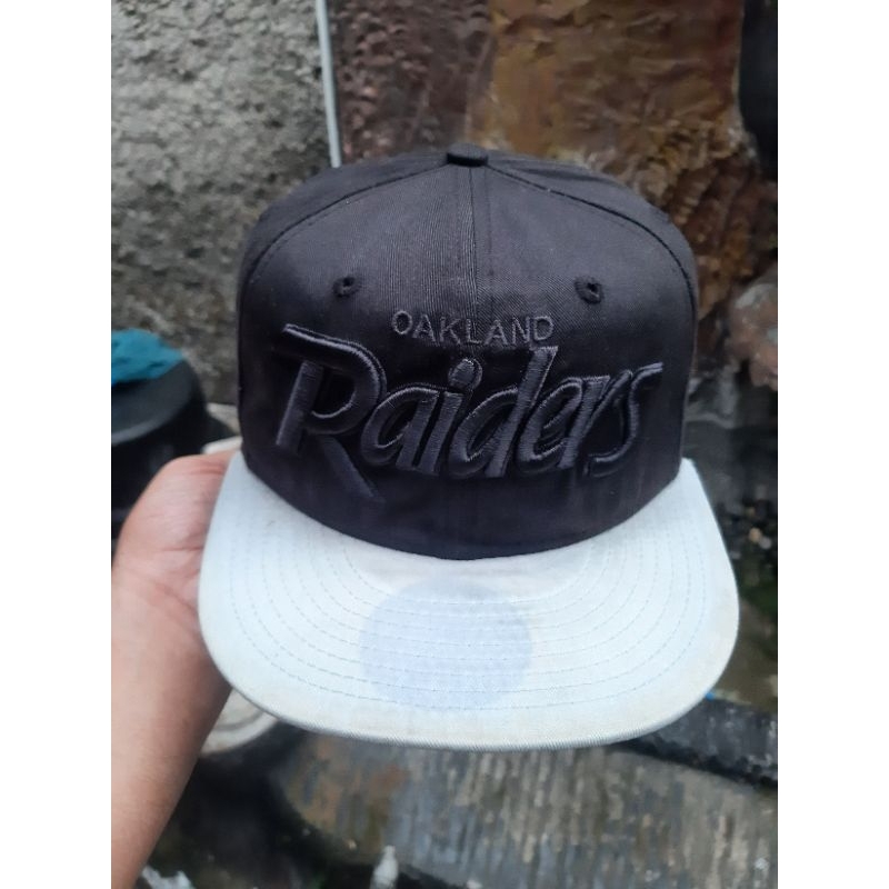 TOPI RAIDER X NEW ERA
