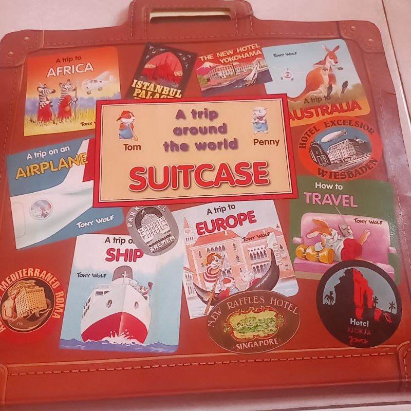 a trip around the world suitcase by tony wolf
