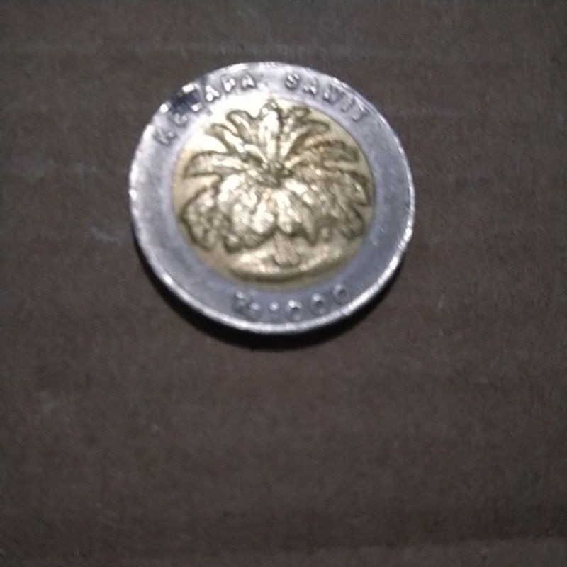 uang koin seribu(1000) sawit kelapa