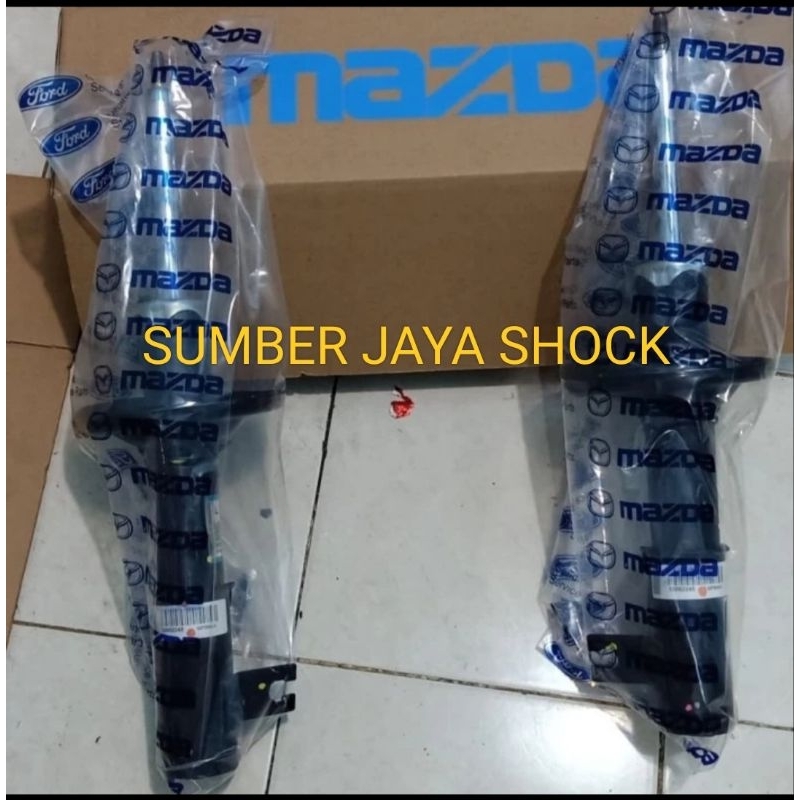 shockbreaker Mazda interplay 323 depan original