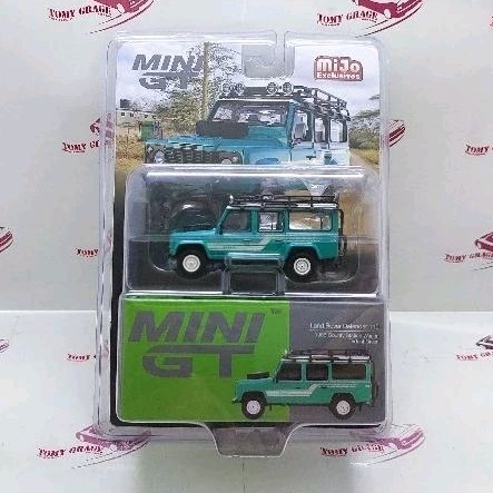 Mini GT 590 Land Rover Defender 110 1985 County Station Wagon Trident Green Blister