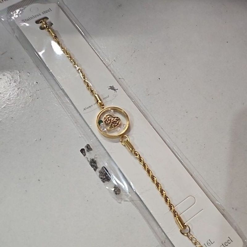 gelang titanium lilit gold