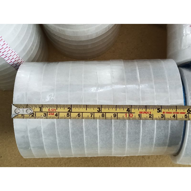 

isolasi bening merk TOMARU lebar 12mm panjang 72 yard kualitas bagus, bening