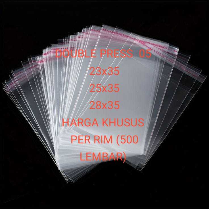 

PLASTIK OPP 05 23x35 25x35 28x35 BAJU ANAK KERUDUNG GARMEN 500 PCS/1 RIM 25MICRON