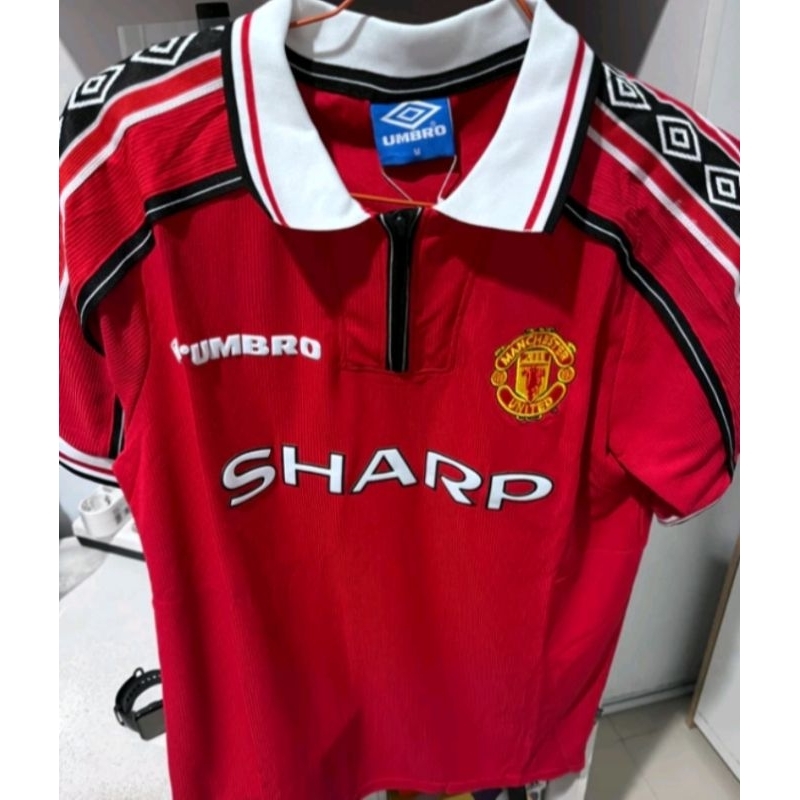 (BARU) JERSEY BOLA RETRO MANCHESTER UNITED HOME TRIBBLE WINNER 1999