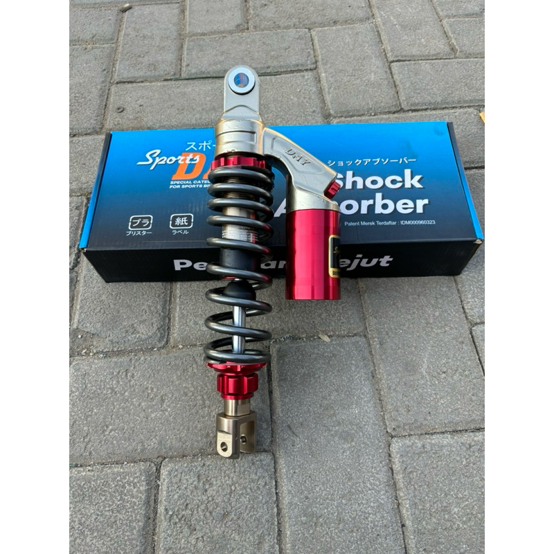 Shock Belakang Metic Merek Day Merah