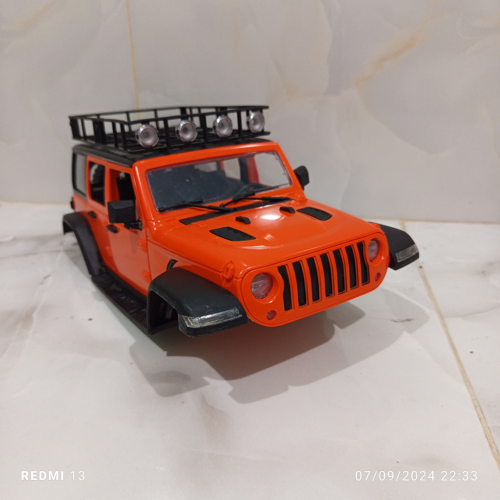 body/bodi mn128 jeep rubicon skala 1/12 warna orange plus lampu realistik dan ban cadangan kondisi b