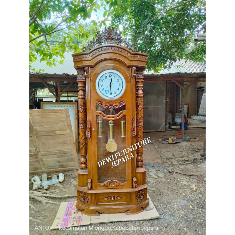 lemari jam ukiran mawar furniture Jepara