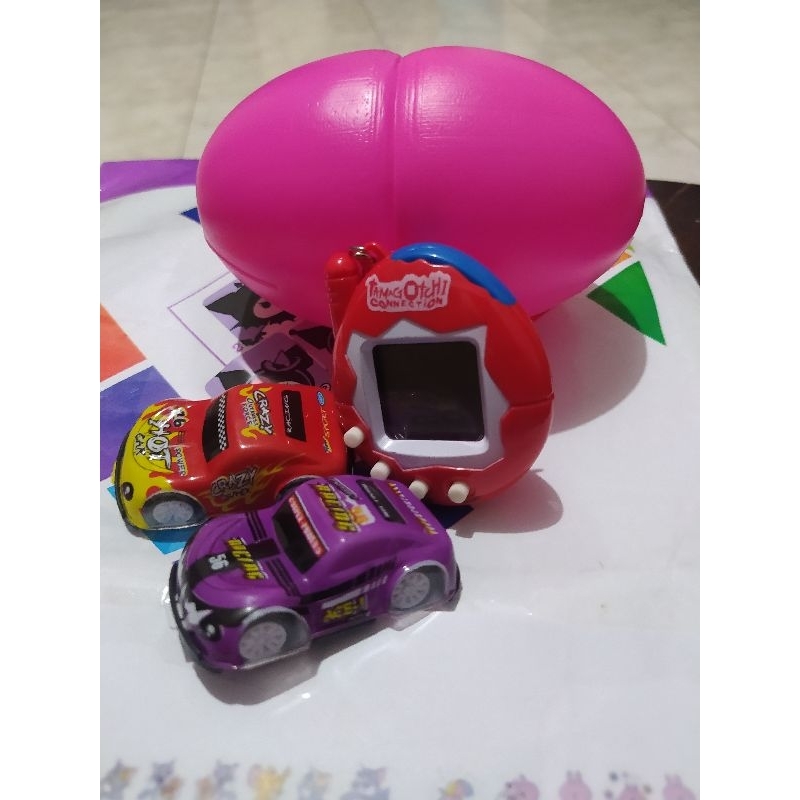 Tamagoci   Tamagochi  Dino  dalam Cangkang telur 168 in 1  Dan 2 mainan Mobil pull back