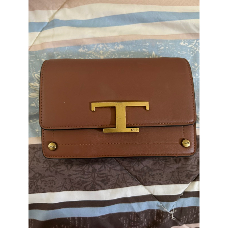 preloved tods sling bag
