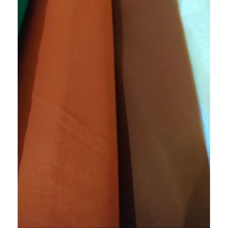 Kain polosan bsy warna oren dan bata untuk seragam bawahan qiroati termurah dan berkualitas