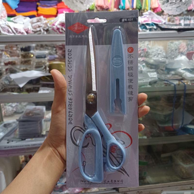 

Gunting Kain De Xian 9