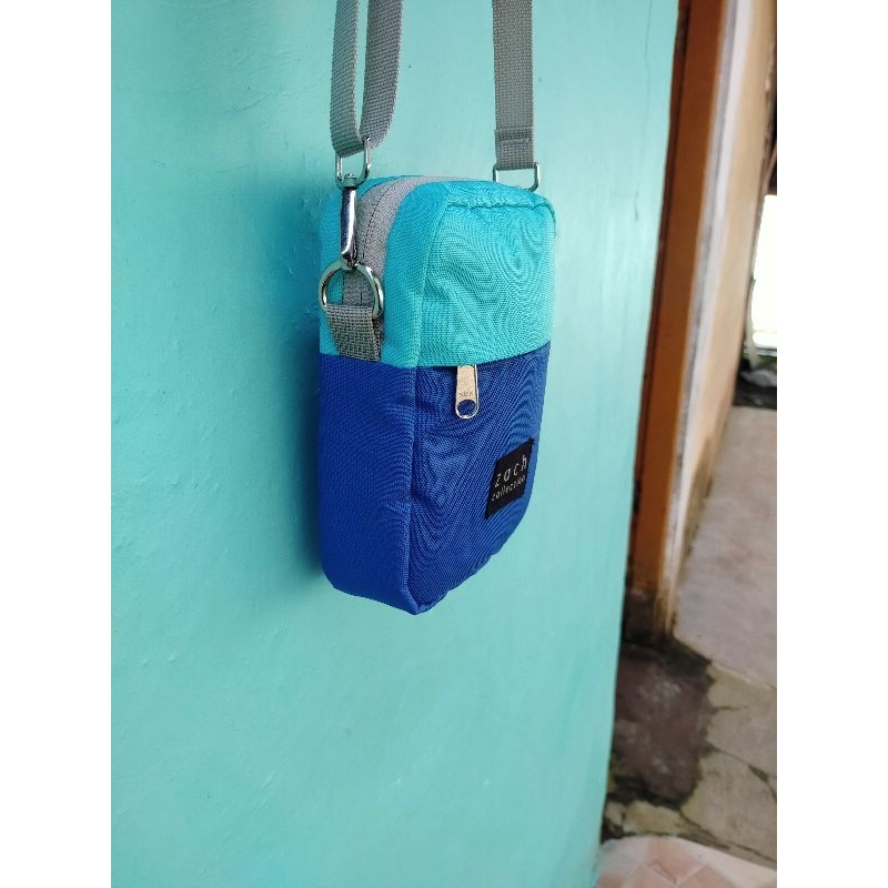 Tas slempang zach.zipper ykk.warna mint+biru