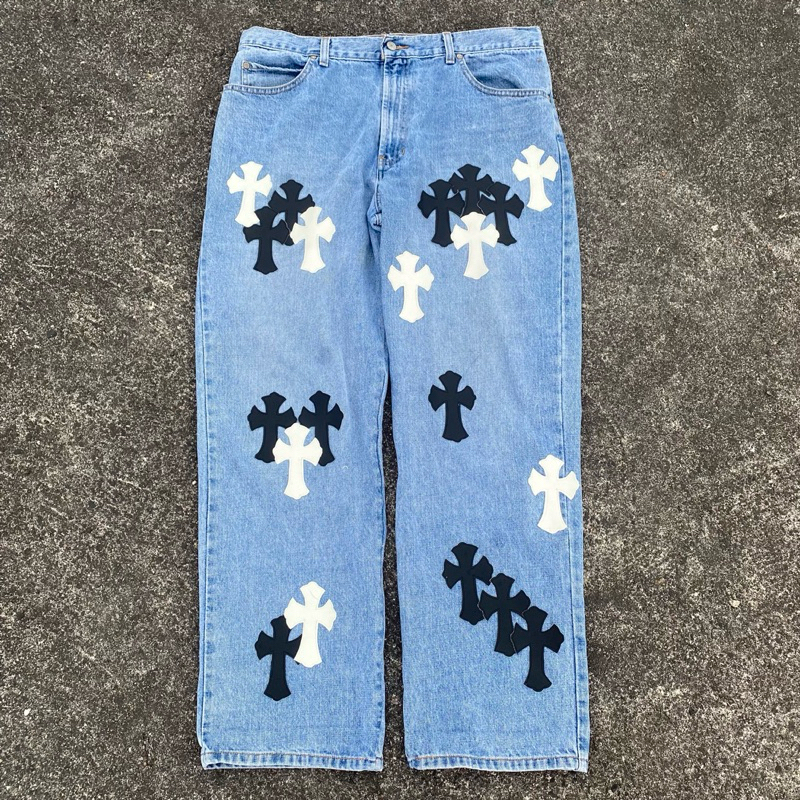 DENIM JEANS WITH CHROME HEARTS PATCH