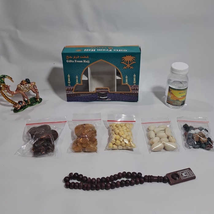 

Discount PAKET oleholeh haji dan umroh air zamzam ori kacang pistachio coklat kerikil tasbih kayu