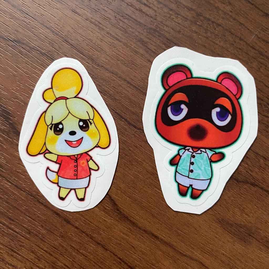 

[ACNH / Animal Crossing New Horizons Characters Homemade Stickers] Dog + Raccoon Vinyl Stickers / Stiker Vinyl Anjing + Rakun (Isabelle & Tom Nook)