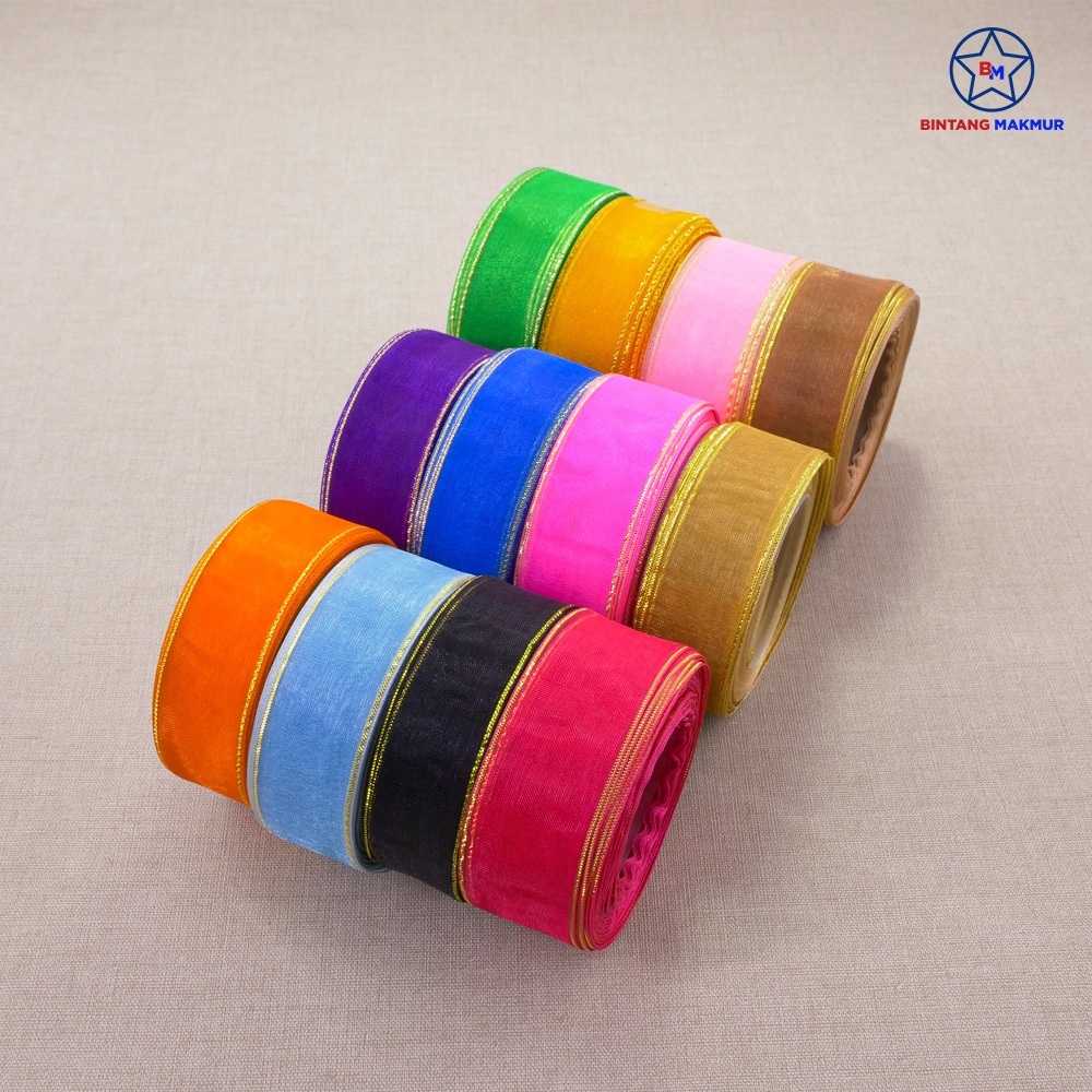 

Pita Organdi List Emas Biru 20 Yard All Size - Harga Yang Tertera Per Roll
