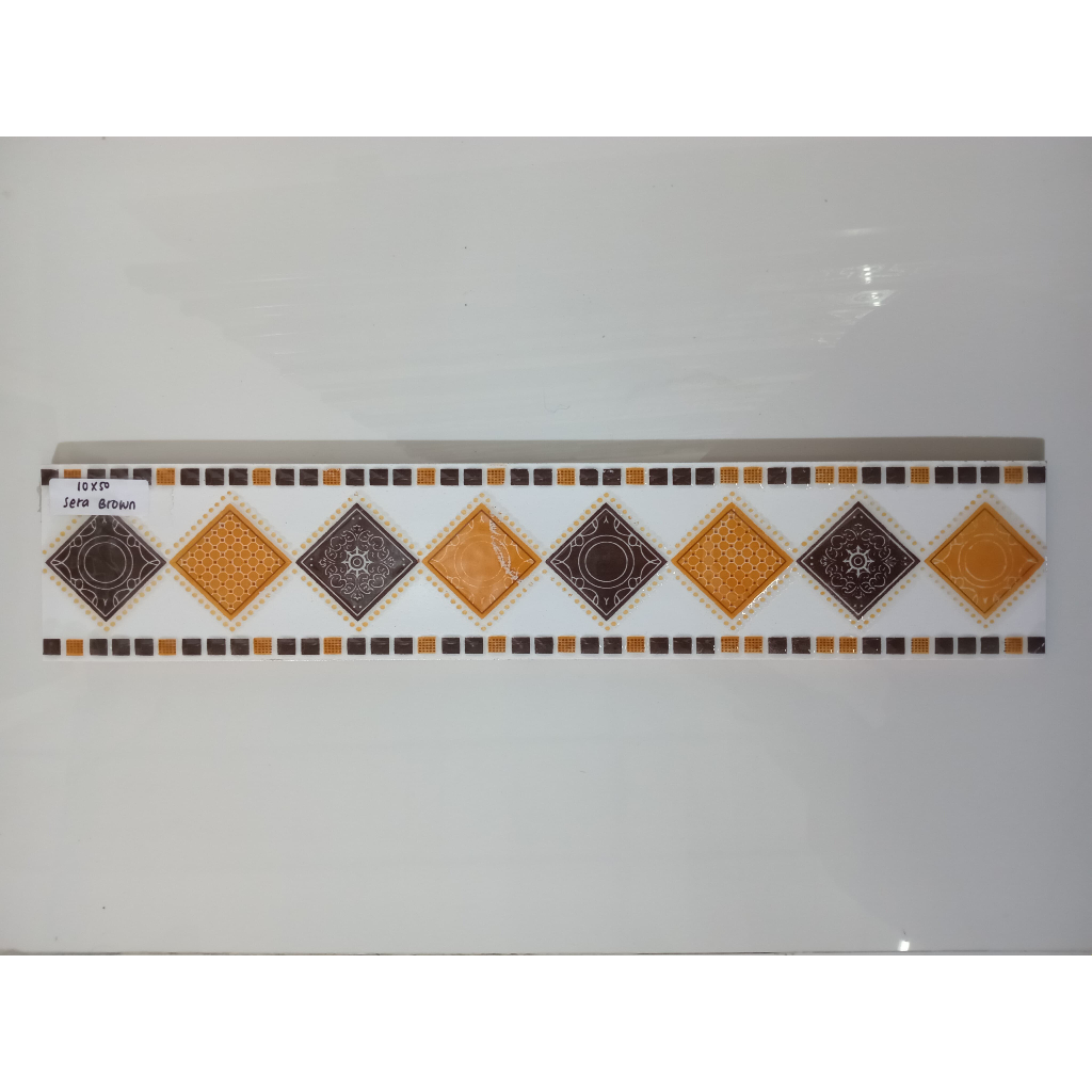 LIST KERAMIK 10 x 50 SERA BROWN/ LIST DINDING MOTIF PRISMA/ LIST DINDING MINIMALIS MOTIF SANDIRA BRO