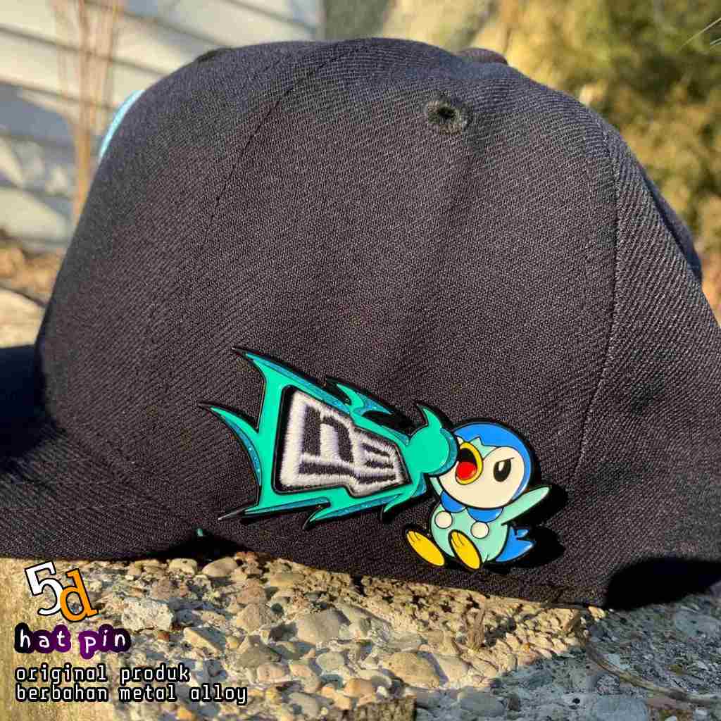 PIN TOPI NEW ERA BINGKAI POKEMON PIPLUP