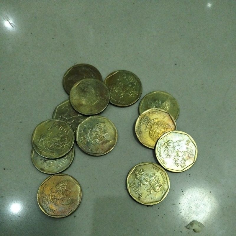 uang Rp100 karapan sapi