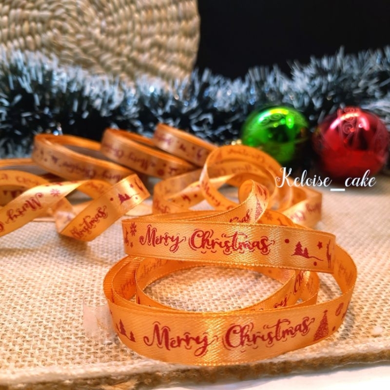 

PITA SATIN NATAL/CHRISTMAS WARNA GOLD(COKLAT MUDA) UKURAN 1 CM PANJANG 18 METER