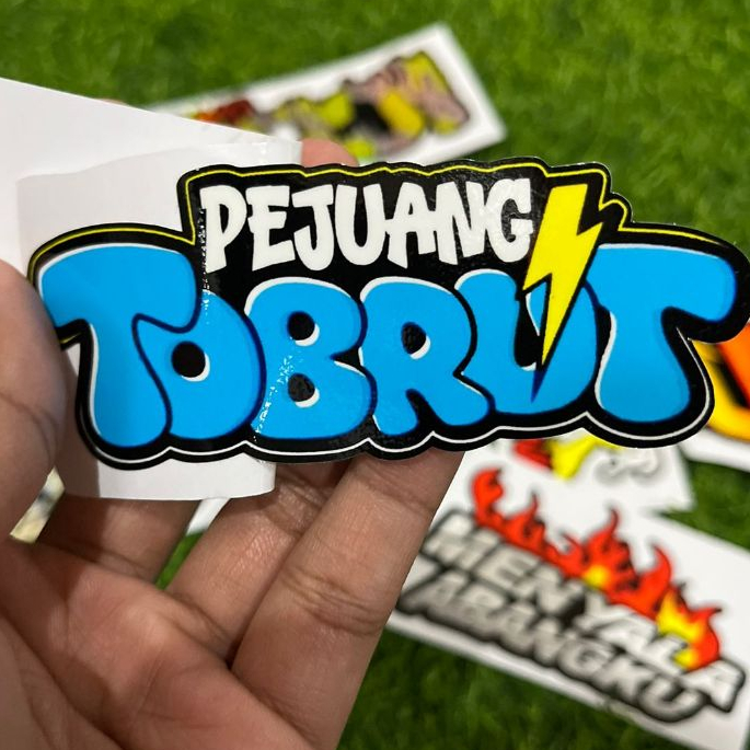 

Sticker Pejuang Tobrut 10cm x 4cm: Vinyil Glossy & Hologram Sudah Cutting Presisi