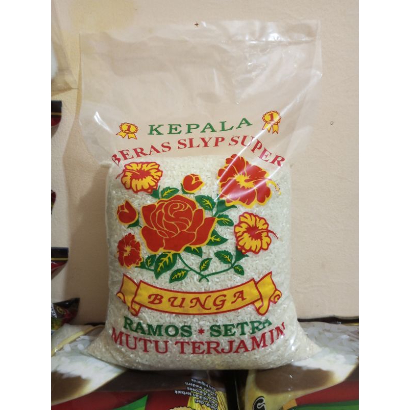 

Beras kemasan cap bunga ramos setra isi bersih 5kg beras pulen