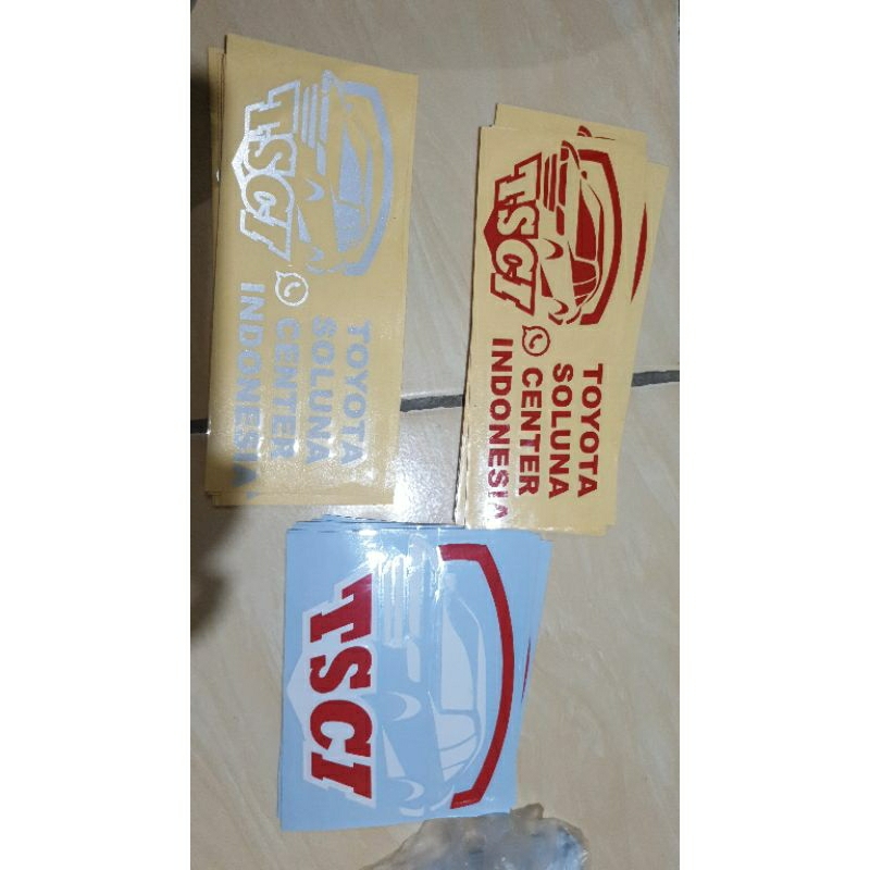 

Stiker TSCI resmi belakang