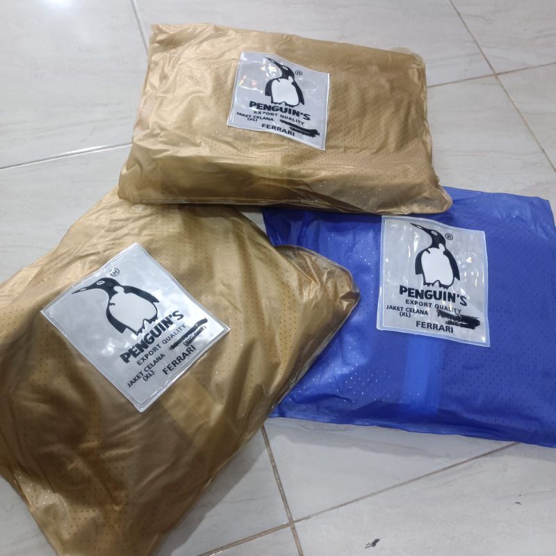 JAS HUJAN PINGUIN FERARI BAJU CELANA