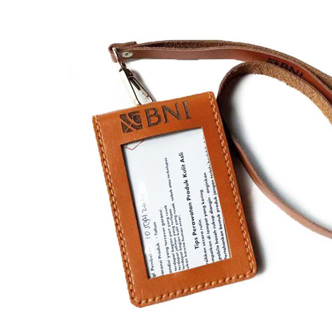 

TIPE RCI317 Name Tag Id Kulit Asli Logo Bank BNI Model Saku Lipat dan Tali Warna Tan Garansi 1 Tahun
