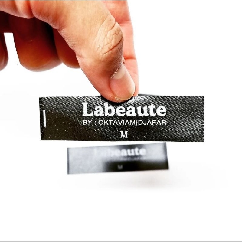 

label baju custom satin hitam 2cm harga per lusin