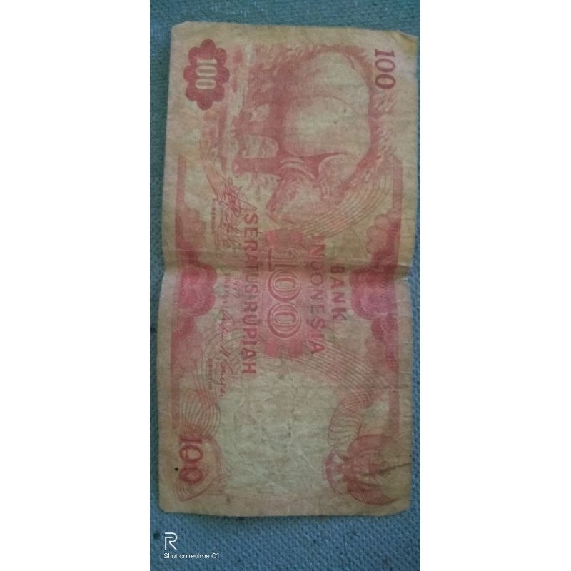 uang kertas kuno Rp.100 gambar badak tahun 1977 di jamin ke aslianya