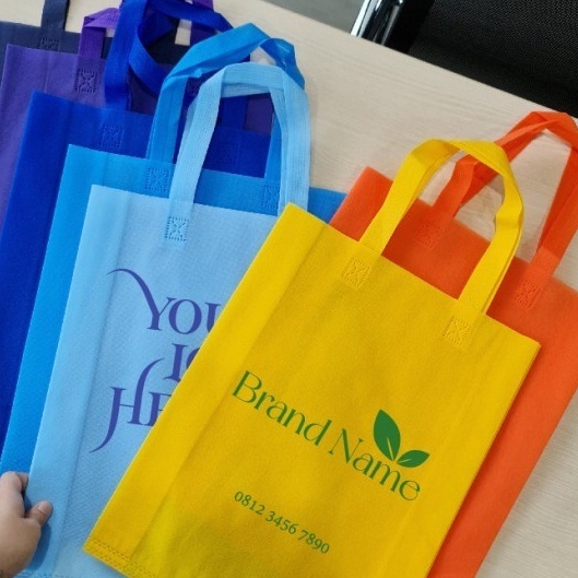 

[30X40] Tas Spunbond Press Handle Lipat Samping 30x40 cm Kantong Goodie Bag Custom Logo