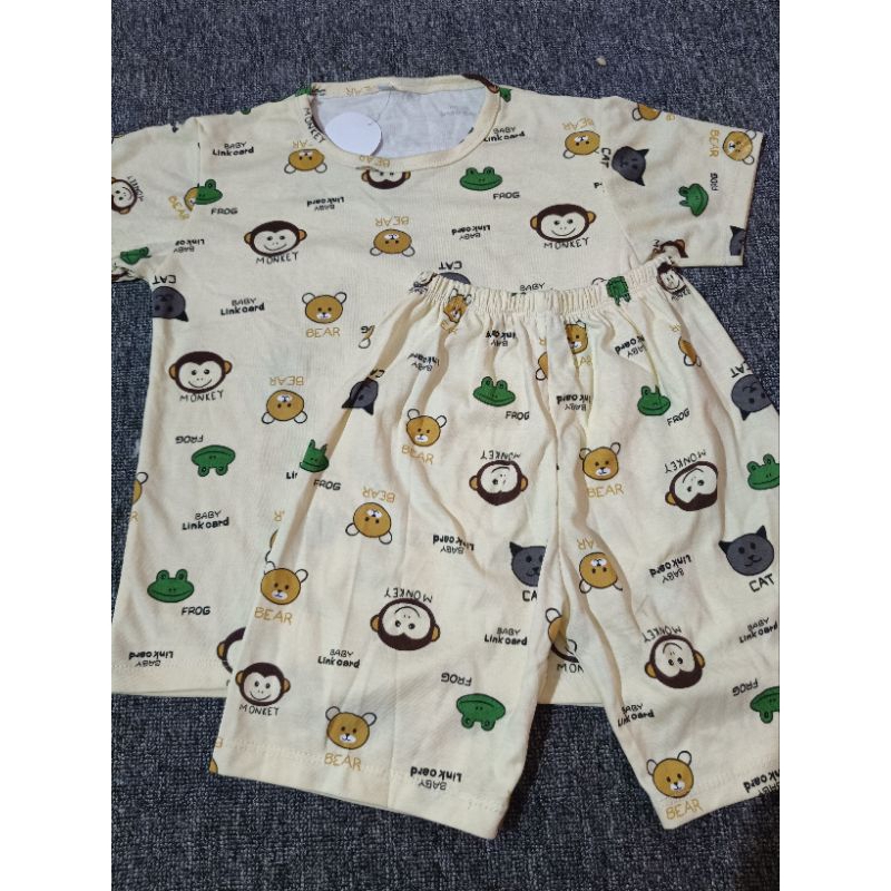 Setelan cotton organik motif kartun