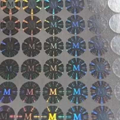 

Sticker Hologram Original M uk. Diameter 1,5 cm 100 pcs warna Blue, Gold dan Silver