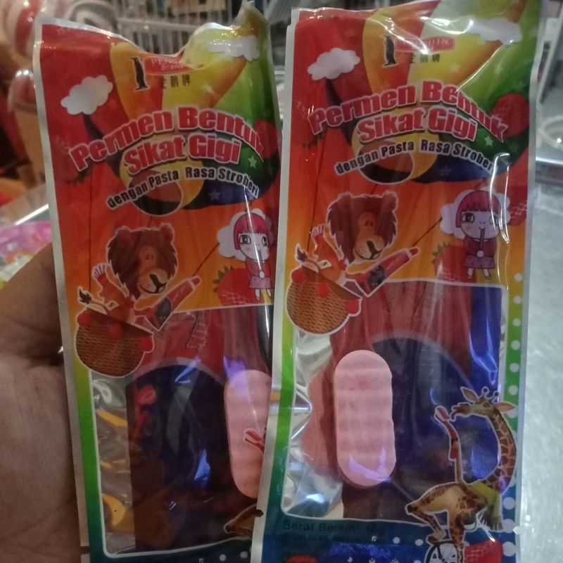 

permen bentuk sikat gigi dan pasta gigi