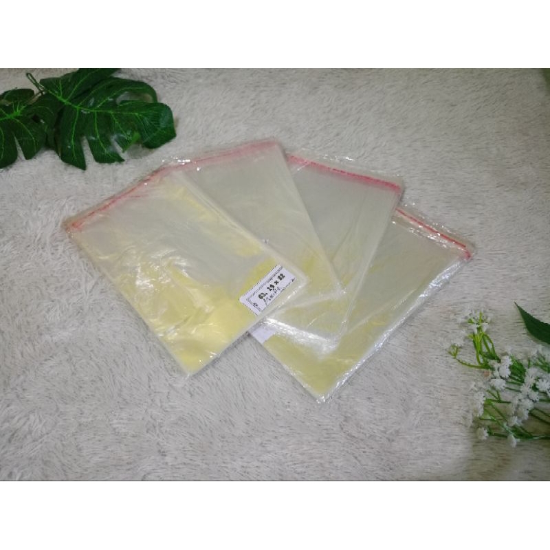 

PLASTIK OPP LEM UKURAN 14X22CM isi 100
