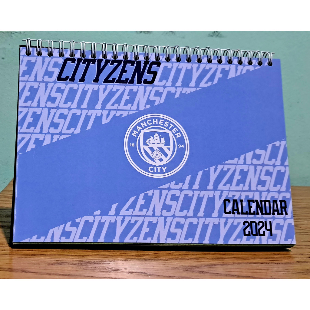 

KALENDER MEJA 2024 EDISI MANCHSTR CITY