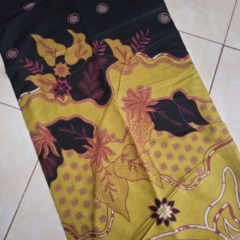 kain batik printing warna lime motif daun abstrak