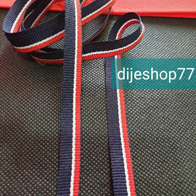 

Pita kain 1cm merah navy/ pita list per METER / Pita kado kerah baju / pita twill tape list webbing bisban motif / pita list kemeja / pita twill tape denim jeans