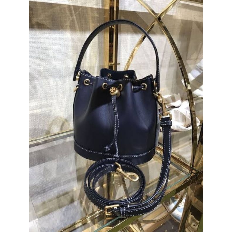 tory burch monogram bucket 21 leather tb